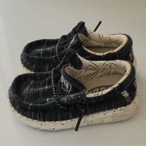 The Hey Dude Toddler K5 Black White Sport Wally Knit Slip On Shoes